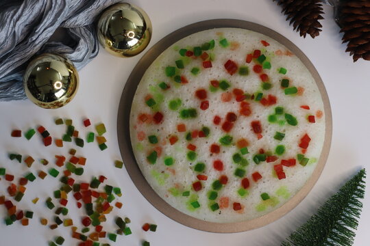 Vattayappam with tutti fruity, a Kerala sweet dish. Vattayappam is a steamed rice cake with coconut and yeast