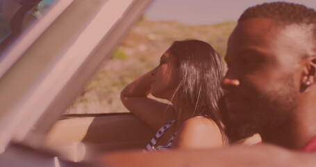 African american couple in a car during a roadtrip