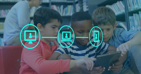 Image of digital icons over schoolboys using digital tablet