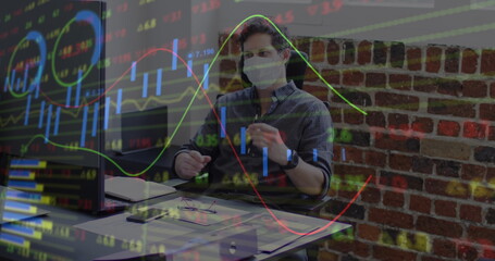 Image of financial data processing over businessman wearing face mask