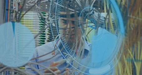 Image of data processing over caucasian male engineer connecting wires