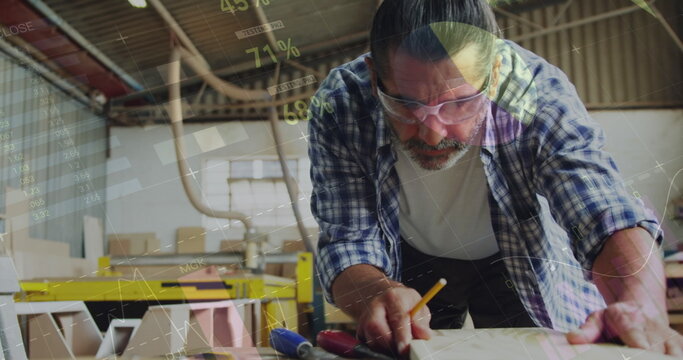 Image of data processing over caucasian male carpenter working in workshop