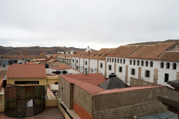 Image shows sequence of buildings on the left photographed from a viewpoint in the city of Potosí