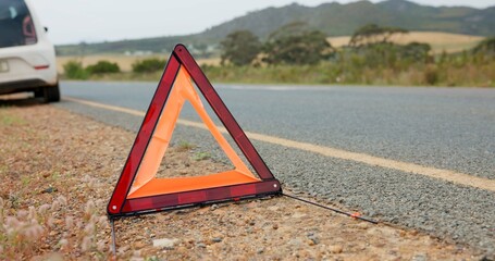 Road, triangle and car breakdown for shape, sign or vehicle assistance in the outdoor countryside....