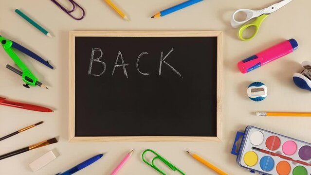 Back to School. Chalk writing on blackboard. Concept of beginning of school year. First day of preschool. Welcome inscription. Stop motion animation