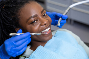 Multicultural lady in dental clinic doing teeth checkup