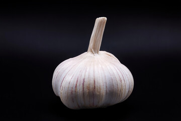 garlic bulb isolated on dark background