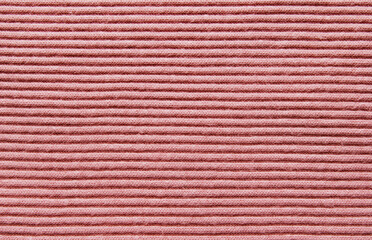 Soft pink color ribbed jersey fabric pattern close up as background