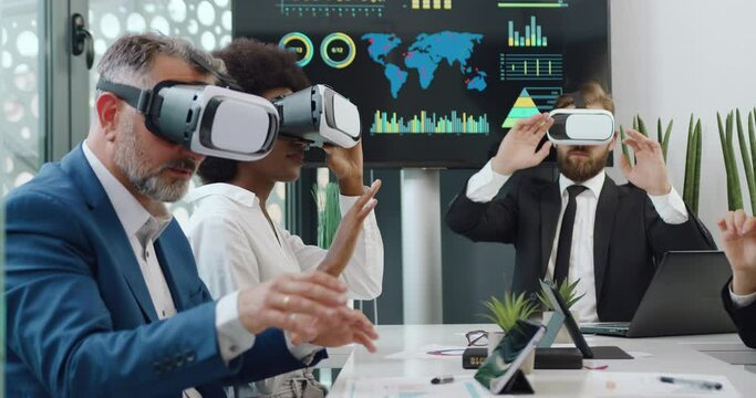 Attractive mixed race business people colleagues which working together in meeting room in special vr 3d glasses