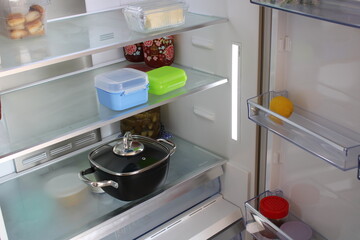 Empty refrigerator. Concept of poverty idea, food crisis, gluten allergy and celiac disease. Drought, famine and epidemic concept.