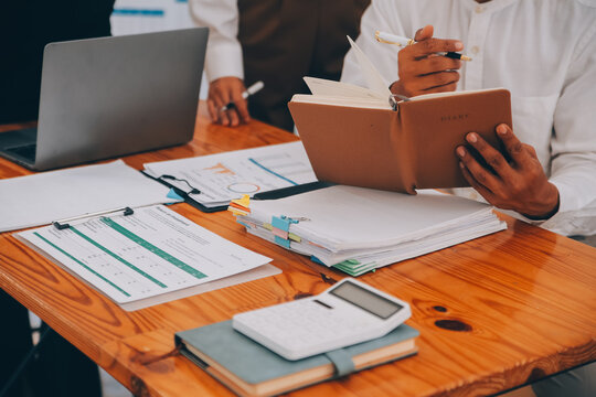 Entrepreneurs and business people conference in modern meeting room, happy multiracial coworkers have fun cooperating working together at office meeting, asian teamwork concept