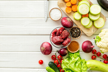 Meat beef stew - raw meat with vegetables for cooking, top view