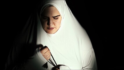 Religious muslim woman in prayer outfit - 747455860