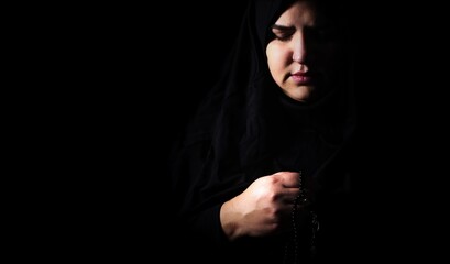 Religious muslim woman in prayer outfit - 747456051