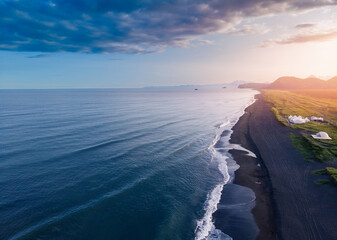 Sunset Landscape of Khalaktyrsky beach with black volcanic sand coast of North Pacific Ocean...