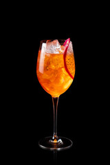 Glass of Aperol Spritz cocktail with Dragon fruit isolated on a black background. Fresh alcoholic cocktail.