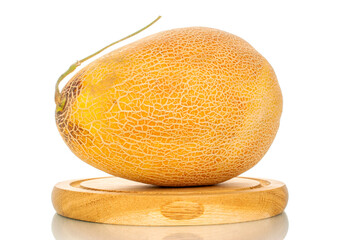 One sweet organic melon on a wooden tray, macro, isolated on white background.