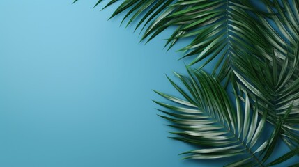 Fototapeta na wymiar A single palm leaf on a vibrant blue background. Perfect for tropical-themed designs