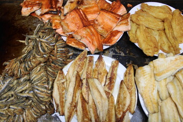 fried fish on the counter. fresh and delicious salmon