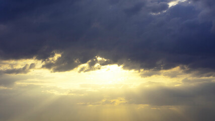 Dramatic  stormy sky, rays of the sun. 16:9