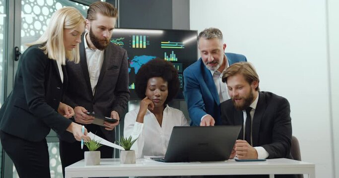 Portrait of multiracial men and woman team of businesspeople which working over business project in conference room