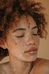 Close-up of a woman with freckles and wet skin.