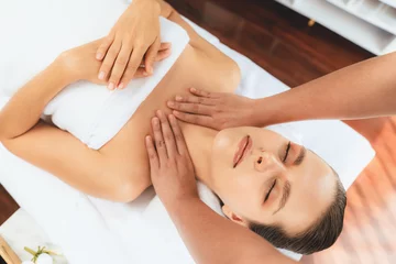 Poster Caucasian woman customer enjoying relaxing anti-stress spa massage and pampering with beauty skin recreation leisure in day light ambient salon spa at luxury resort or hotel. Quiescent © Summit Art Creations