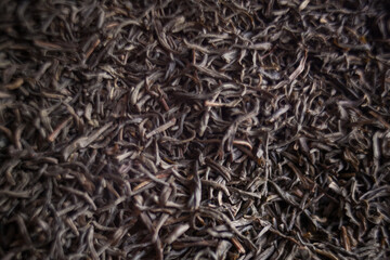 Close up of black tea leaves resemble patterned plant twigs