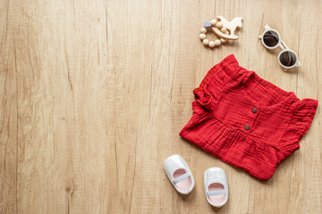 Flat lay of baby dress and accessories. Kids wear flat lay