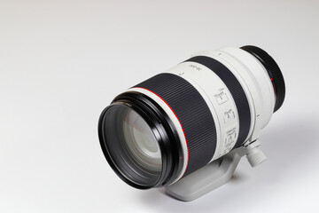 Hight performance Professional camera zoom lens with complicate lens reflections isolated on white background.