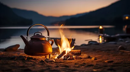 Selbstklebende Fototapeten Vintage coffee pot on camping fire. Wonderful evening atmospheric background of campfire. Romantic warm place with fire. The concept of adventure, travel, tourism and camping. © alexkich