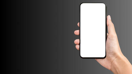 Hand holding cell phone mockup with blank screen. Smartphone mock up isolated on black bacground