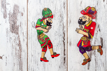 Traditional Turkish Shadow Puppets Karagoz, Hacivat Dancing in Colorful Attire