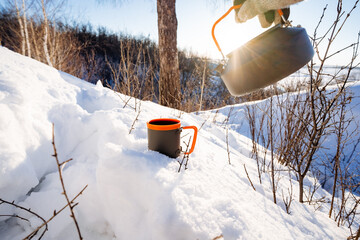 Dishes for a hiker in the mountains, a winter adventure in the forest, solo trekking, a kettle and...
