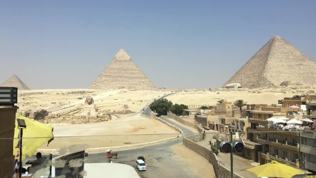 High angle view of the Giza Necropolis with the Sphinx in front.