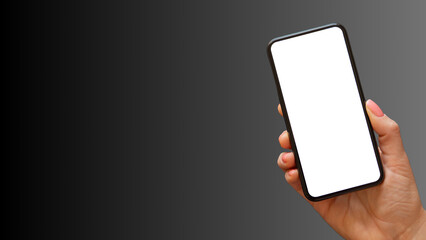 Hand holding cell phone mockup with blank screen. Smartphone mock up isolated on black bacground