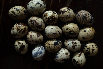 Quail eggs with one broken showing shell texture