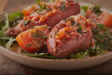 Sweet jacket potatoes filled with beans and cheese with a mixed salad.