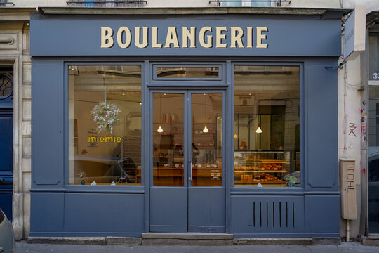 Paris France ,9 june 2023: typical french store facade , fancy parisian blue boutique , french bakery template