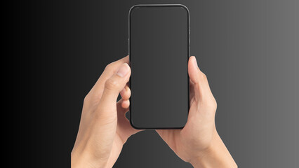 Hand holding cell phone mockup with blank screen. Smartphone mock up isolated on black bacground