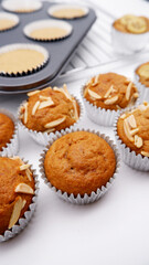 Banana muffins placed on a white background. Muffins or Cupcakes made from bananas, the concept of home cooking, and a dessert menu that is good for health. Close-up banana muffins texture.