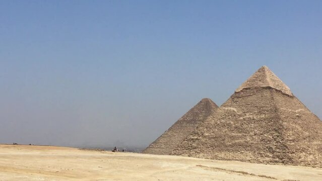 Tight pan across the Giza Necropolis from the desert