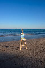 Easel With Painting on Beach