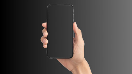 Hand holding cell phone mockup with blank screen. Smartphone mock up isolated on black bacground