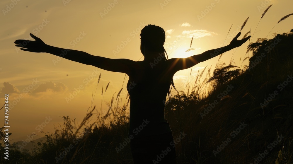 Poster a person standing in a field with arms outstretched. suitable for wellness or freedom concepts