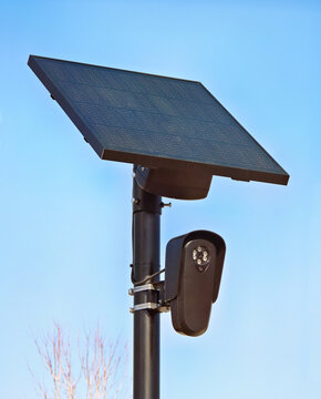 Solar powered security camera watching the community
