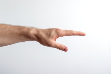 A person's hand reaching out towards an object, perfect for illustrating concepts of reaching, longing, or assistance