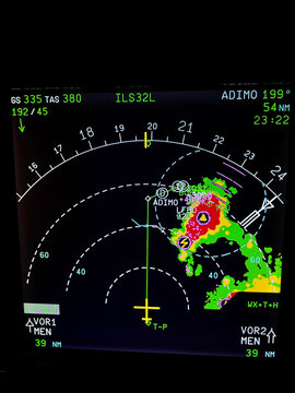 Navigation display of an airplane during an approach with thunderstorms on radar screen 