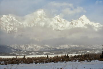 The Grand Teton poking through the clouds; Grand Teton NP; Wyoming