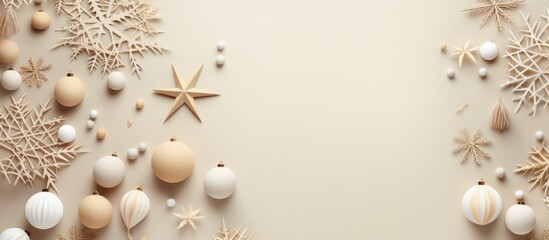 A collection of Christmas ornaments, including bulbs, stars, and snowflakes, hanging on a wall. The ornaments are various colors and sizes, adding a festive touch to the room.